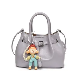 Chic lavender bucket bag with dual handles and cute cartoon pearl charm decoration