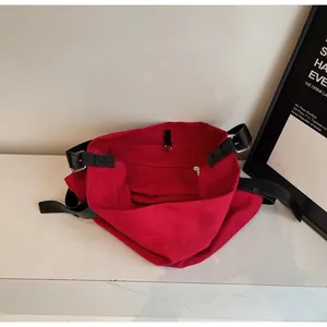 Top view of red canvas tote showing interior compartment with metal zipper pocket