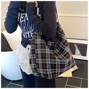 Detail of colorful plaid woven tote bag with large capacity and durable canvas texture