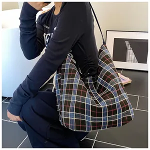 Classic blue and red plaid canvas tote bag with large capacity and durable shoulder strap
