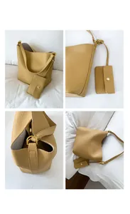 Vue détaillée du sac seau jaune moutarde en cuir grainé avec petite pochette amovible