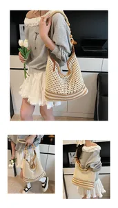 Detail of woven hobo bag with striped base and decorative wooden bead shoulder strap