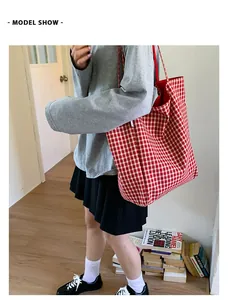 Model show of a large capacity red checkered canvas tote bag for casual daily use