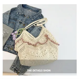 Detail of hand-crocheted beige tote bag with purple wavy trim and hollow knit texture