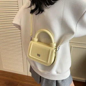 Minimalistische crèmegele kleine vierkante handtas met kogelgreep voor dames