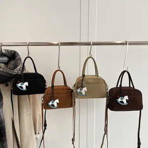 Retro Boston style small handbags in four colors with rocking horse charms and straps