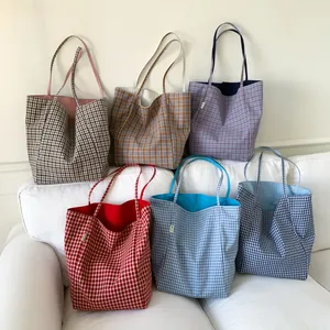 Collection of six classic checkered canvas tote bags in various vintage colors for women