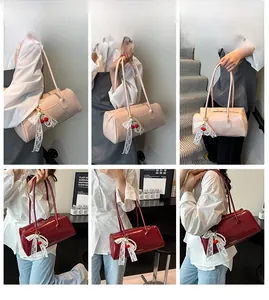 Detail view of glossy leather handbags with lace bows and cherry charms in various angles