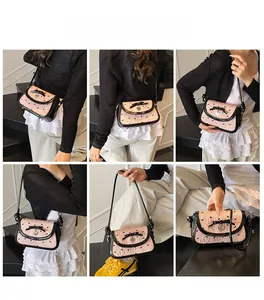 Detailed model shots of a pink pleated crossbody bag with a black bow and heart charm