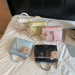 Glossy crinkled leather handbags in five colors with cute teddy bear charms