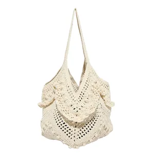 Bohemian off-white hand-knitted tote bag with ruffled layers and woven shoulder strap