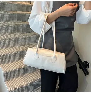 Close-up of white leather shoulder bag detail with Fashion and Bags logo text