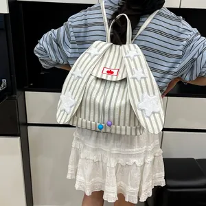 Striped canvas backpack featuring bunny ears, star patches, and a cherry embroidery