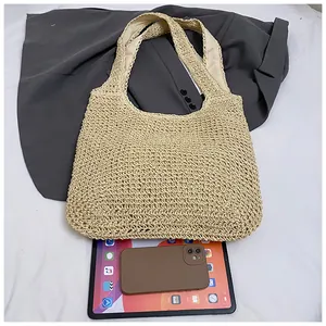 Detail of hand-woven beige tote bag showing texture and large capacity for a tablet