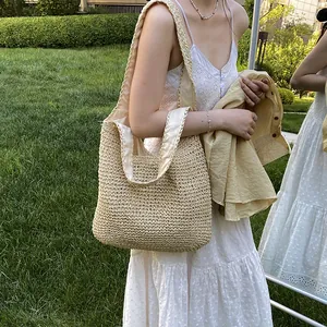 Handwoven straw tote bag for beach vacations, featuring a spacious interior and natural finish