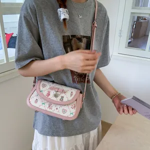 Sweet pink bow crossbody bag with cute cartoon animal prints and metal heart pendant