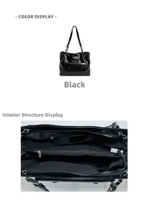 Detail view of black tote bag showing metal chain strap and multiple inner zip compartments