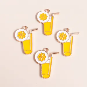 Detail of yellow cocktail cup charms with straw and lemon slice for DIY jewelry