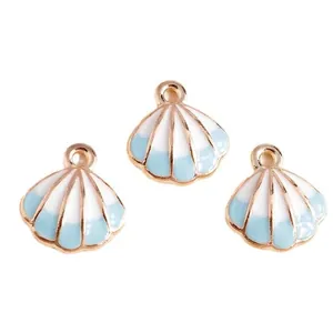 Drie blauw-witte emaille schelphangers met gouden frame voor DIY-sieraden maken