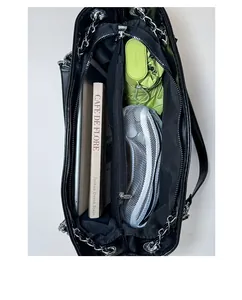 Detail view of large black tote bag interior showing spacious compartments and storage capacity