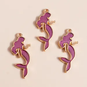 Three purple mermaid charms with golden alloy frames for DIY jewelry making and crafts