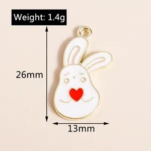 Detailed view of white enamel bunny pendant with heart, measuring 26mm by 13mm