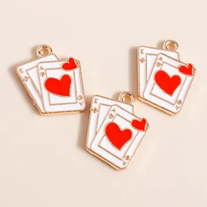 Three pieces of heart-themed poker card charms in gold alloy with red and white enamel