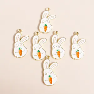 Flat lay of six cute cartoon rabbit and carrot alloy enamel pendants with gold plating