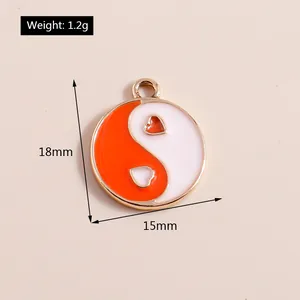Detail view of heart-shaped Yin Yang pendant with 18x15mm dimensions and 1.2g weight