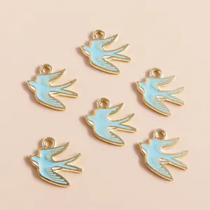 Set of 6 light blue enamel swallow bird charms with golden alloy base for DIY jewelry making