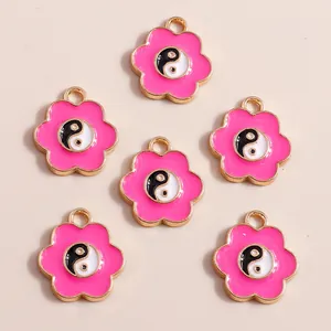 Pink enamel flower charms with yin yang center and gold alloy plating for DIY crafts