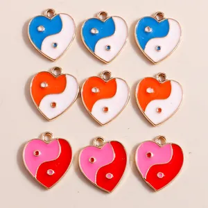 Enamel heart charms with yin yang patterns in blue, orange and pink color assortment