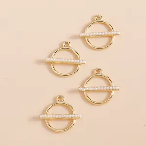 Set of four geometric gold round pendants with imitation pearls for DIY jewelry making