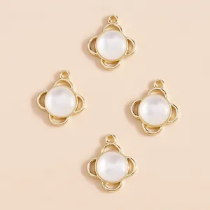Pack of four clover-shaped gold charms with opal stones for DIY jewelry making