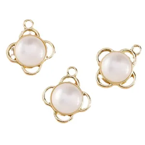 Three gold cat eye stone and pearl pendants with floral hollow frames for DIY jewelry