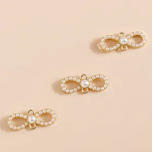 Elegant bow-shaped pendant with gold frame and white cat eye stone beads for DIY jewelry