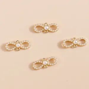 Elegant gold bow pendant with cat eye stone and pearls for DIY jewelry making