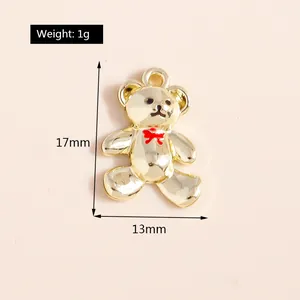 Detailansicht eines 17mm Goldbären-Anhängers mit roter Schleife für DIY-Schmuck