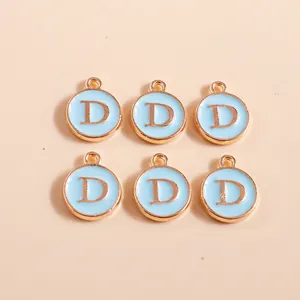 Detailed view of six gold-rimmed round alphabet D charms in light blue for DIY crafts
