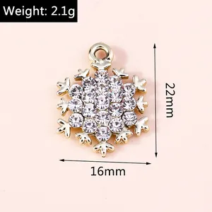 Macro shot of 22mm gold snowflake pendant with crystal rhinestones and size dimensions