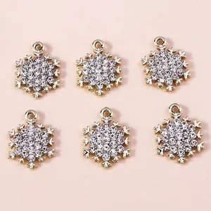 Macro detail of six sparkling silver snowflake charms with inlaid rhinestones for DIY