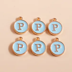 Detail of light blue enamel round P letter charms with rose gold plating for DIY crafts