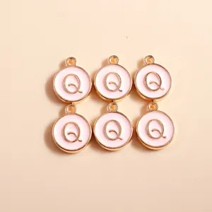 Detail of pink enamel round letter Q charms with gold plating for DIY jewelry
