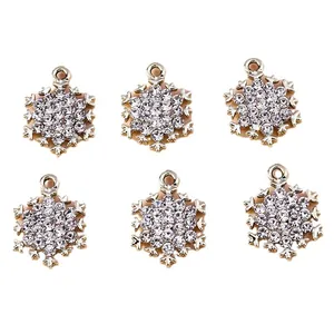 Sparkling snowflake jewelry charms with gold metal plating and white rhinestones for DIY crafts