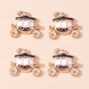 Golden pumpkin carriage charms with black and white enamel for DIY jewelry making