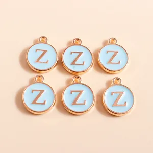 Macro detail of blue enamel letter Z charms with golden metal edges for DIY jewelry