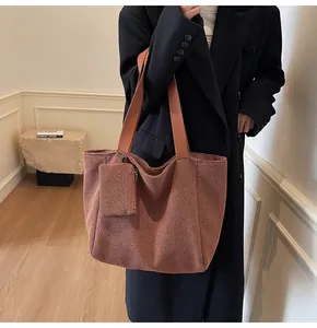 Caramel woven tote bag set with matching zipper pouch and wide fabric shoulder strap