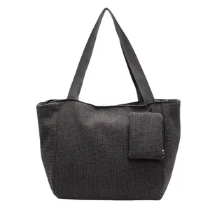 Charcoal grey woven tote bag with wide strap and matching small zipper pouch set