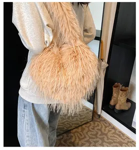Close-up of heart-shaped faux fur tote bag in soft beige with plush texture
