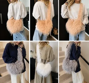 Detail view of large heart-shaped plush tote bag in beige, grey and white faux fur colors